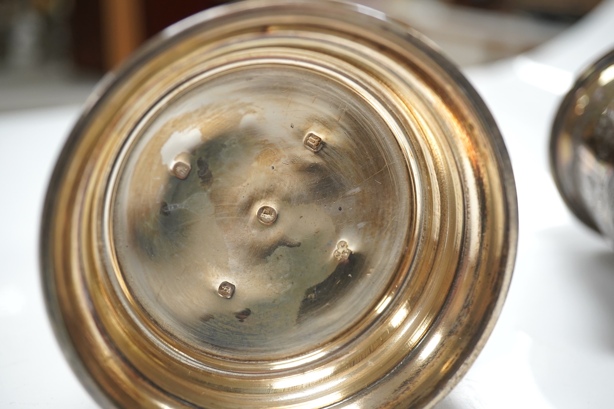 A George V Brittania standard silver kitchen pepper, by John Charles Lowe, London, 1935, 11.5cm and a Victorian silver christening mug, 10.4oz. Condition - poor to fair